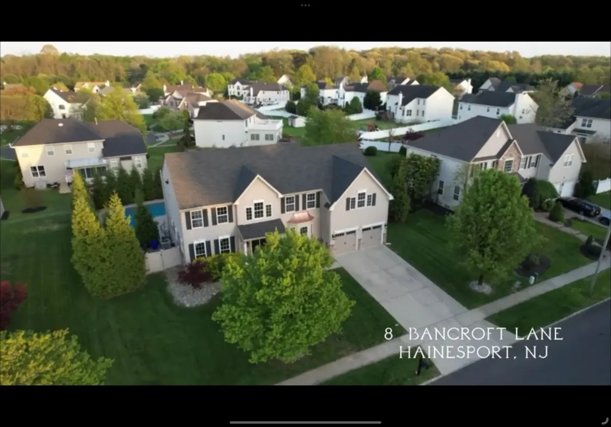 Hainesport house, swimming pool, lawn and neighboring properties from above