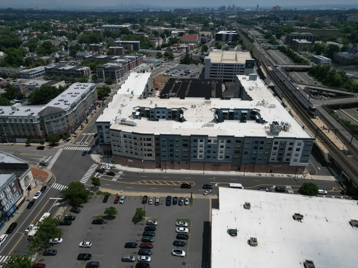 Aerial view of The Crossings with apartment blocks and parking deck